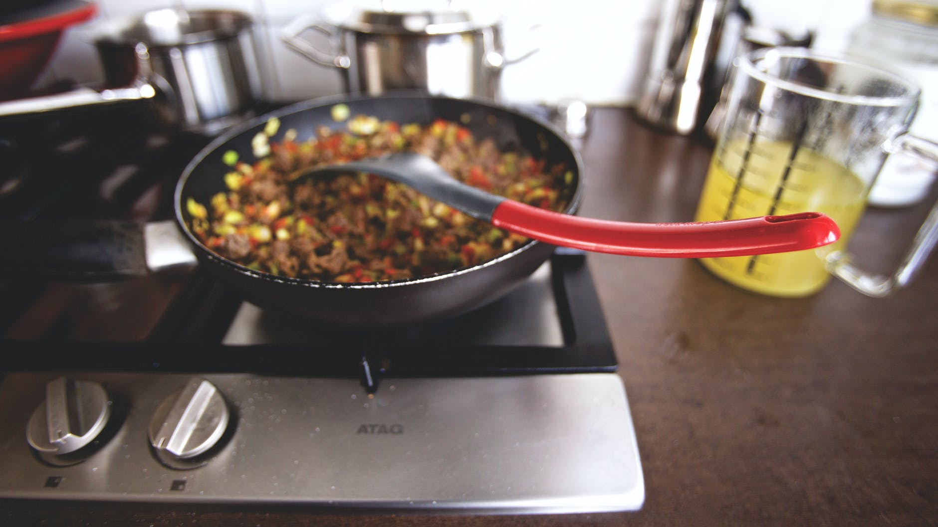 dish cooking on black non stick pan on a burner